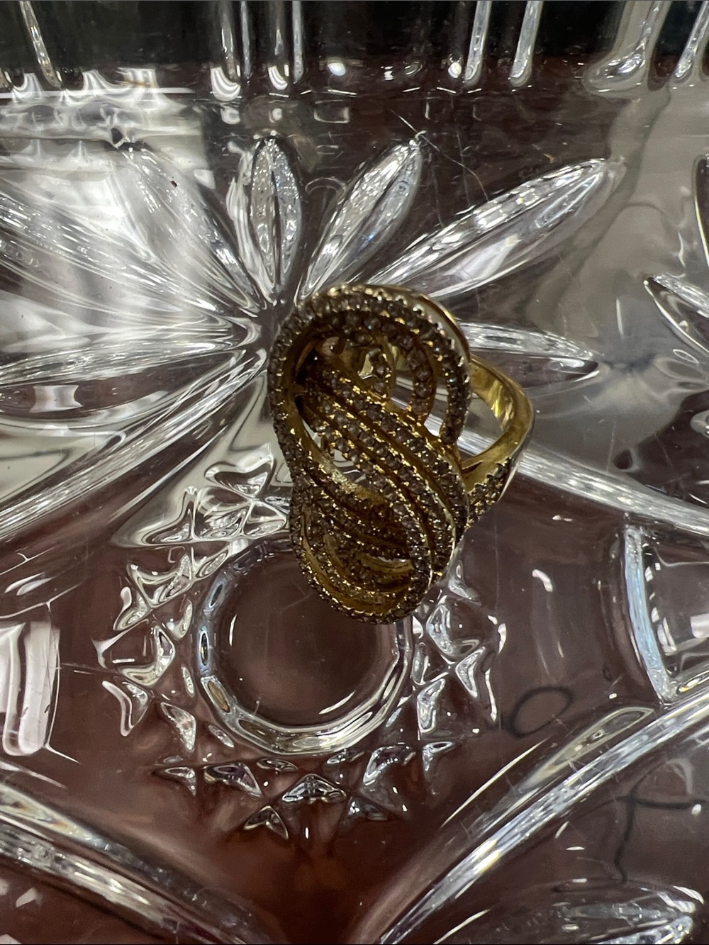 large cocktail or statement ring with a unique, multi-layered design.